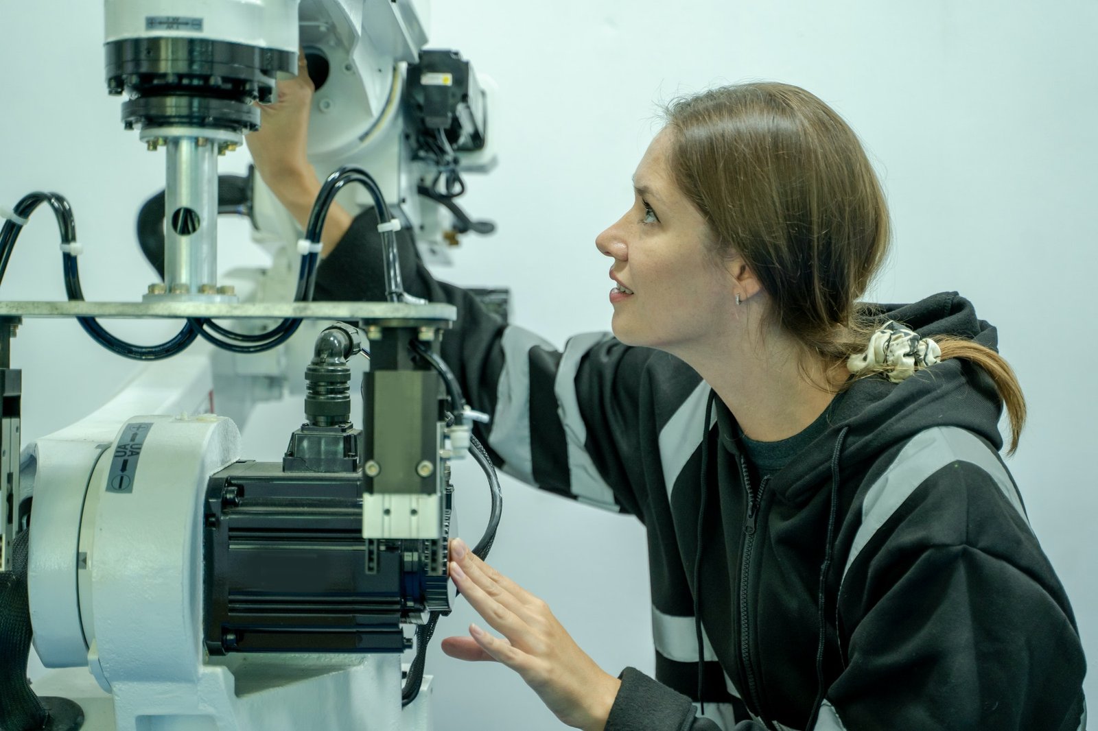 Professional Development Engineer is testing Robot arm at lab,Technology and innovation concept.