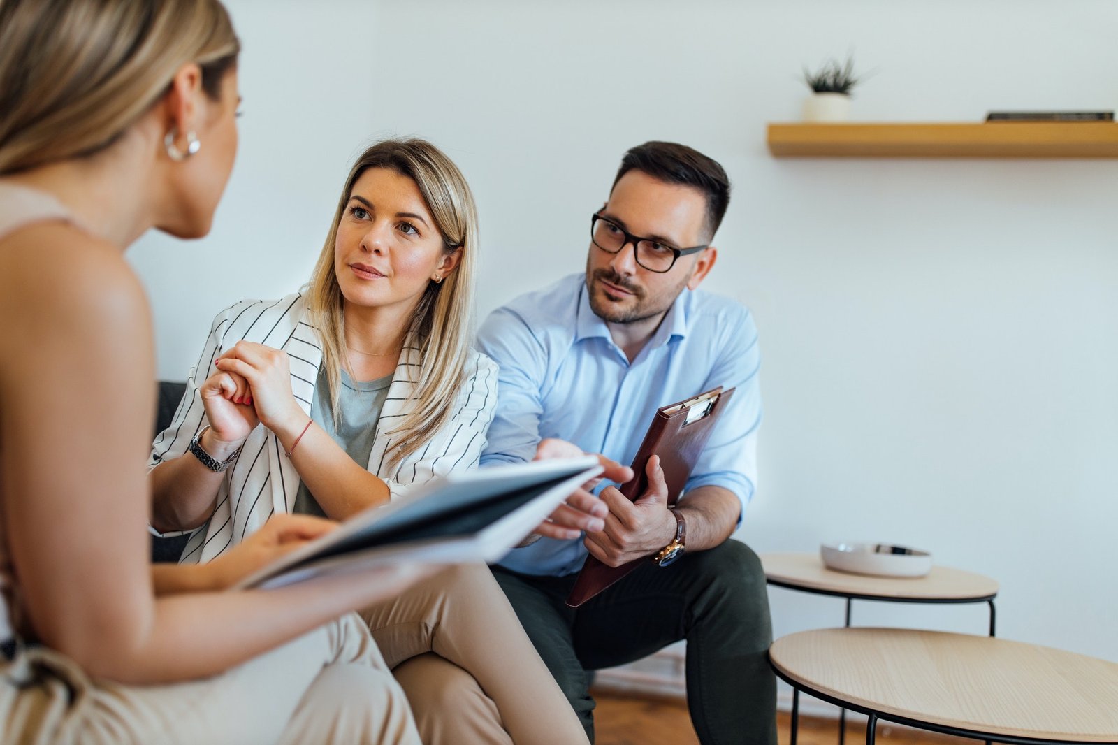 Team of lawyers listening to a client, portrait.